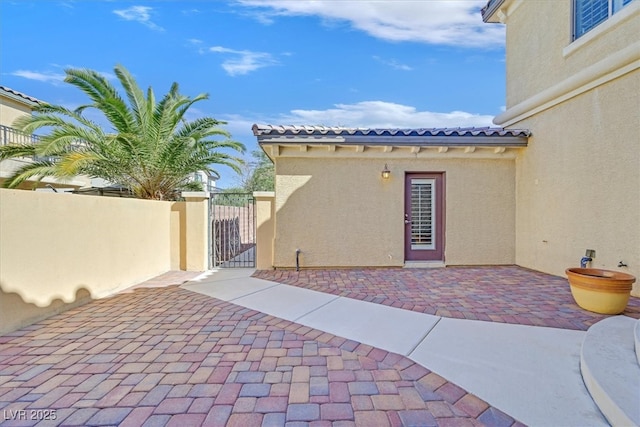 view of patio / terrace featuring a gate and fence