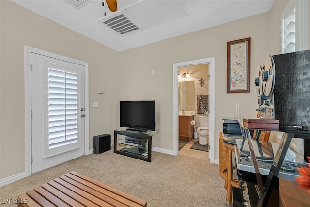 living room with ceiling fan, baseboards, visible vents, and light colored carpet