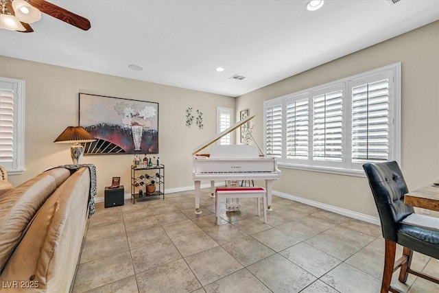 interior space featuring tile patterned flooring, baseboards, ceiling fan, and recessed lighting