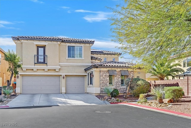 mediterranean / spanish home with a garage, a tile roof, stone siding, driveway, and stucco siding