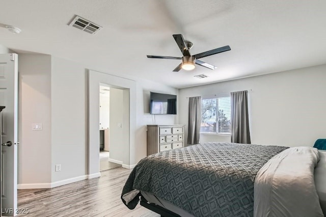 bedroom featuring light wood finished floors, baseboards, visible vents, and ceiling fan