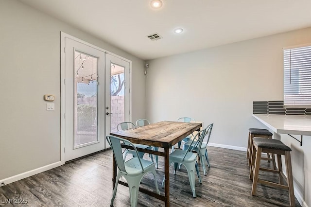 dining area with baseboards, visible vents, dark wood finished floors, french doors, and recessed lighting