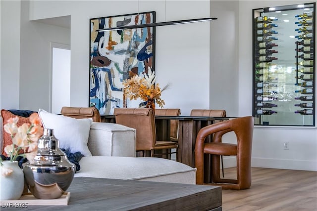 dining room with wood finished floors and baseboards