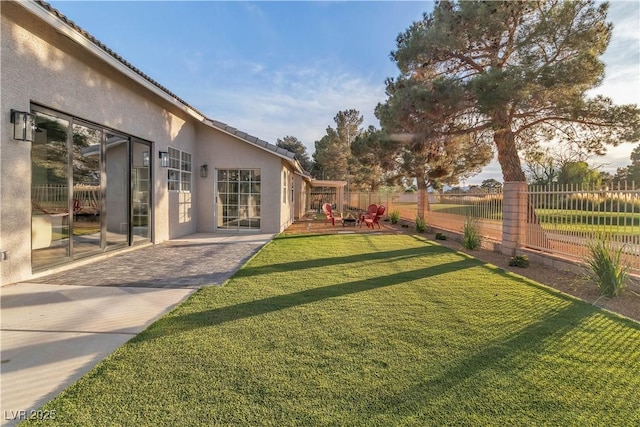 view of yard with a patio area and fence