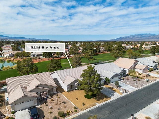 aerial view featuring a mountain view and a residential view