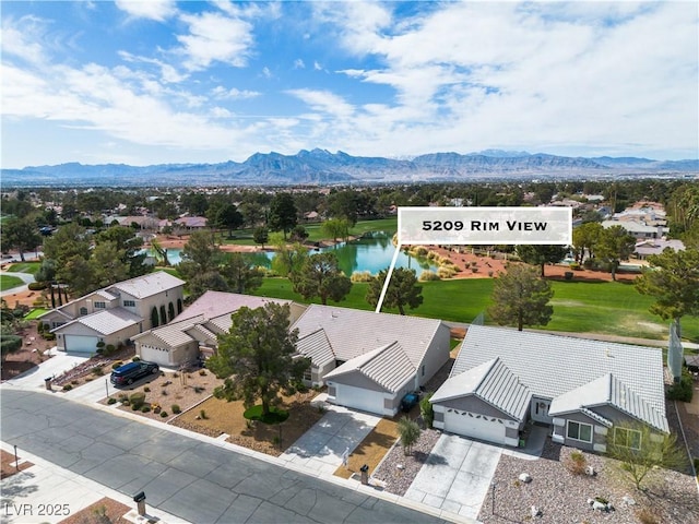 birds eye view of property featuring a mountain view and a residential view