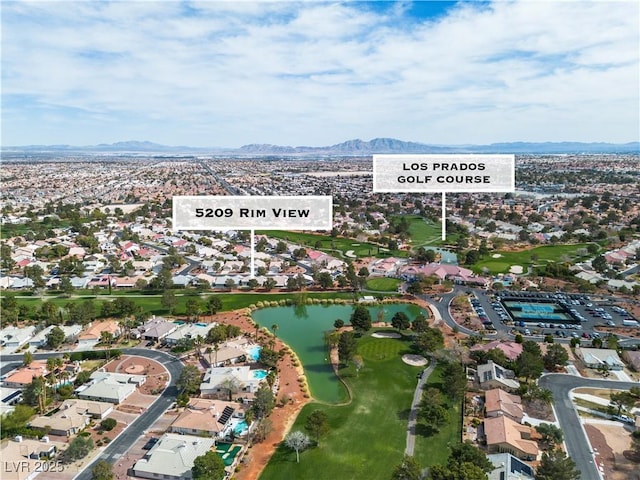 drone / aerial view featuring a residential view and a water and mountain view