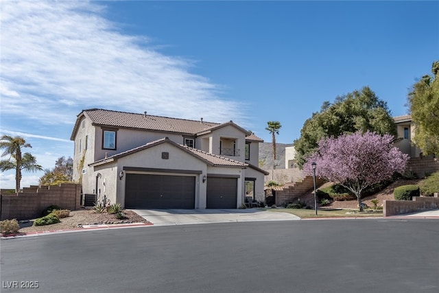 view of front of home featuring cooling unit, a garage, fence, driveway, and stucco siding