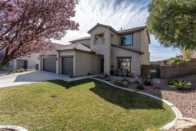 view of front of home featuring an attached garage, driveway, fence, and stucco siding