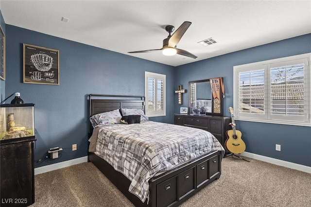 carpeted bedroom with baseboards, visible vents, and ceiling fan