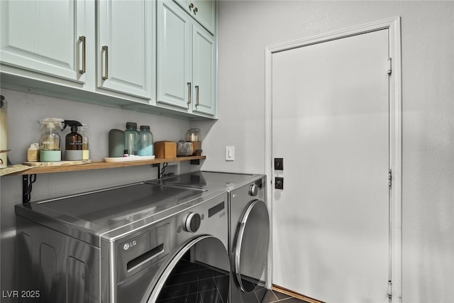 laundry room featuring cabinet space, washer and clothes dryer, and a bar