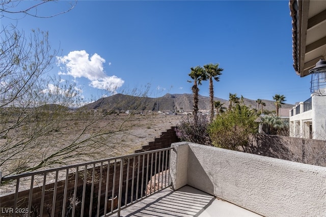 balcony featuring a mountain view