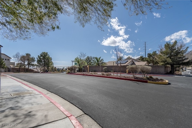 view of road with curbs and sidewalks