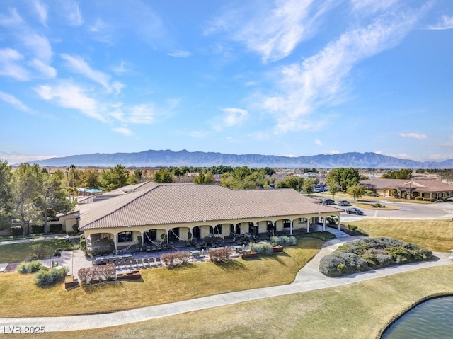 birds eye view of property with a mountain view