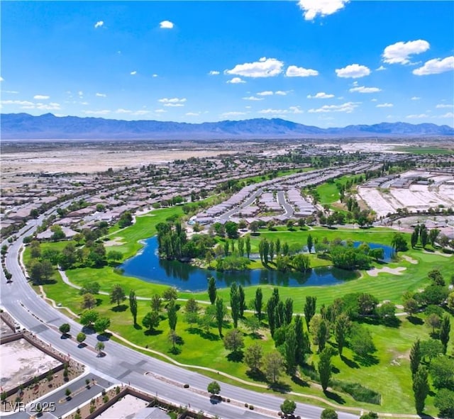 birds eye view of property with a water and mountain view