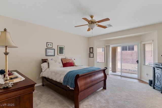 bedroom with baseboards, light carpet, visible vents, and access to outside