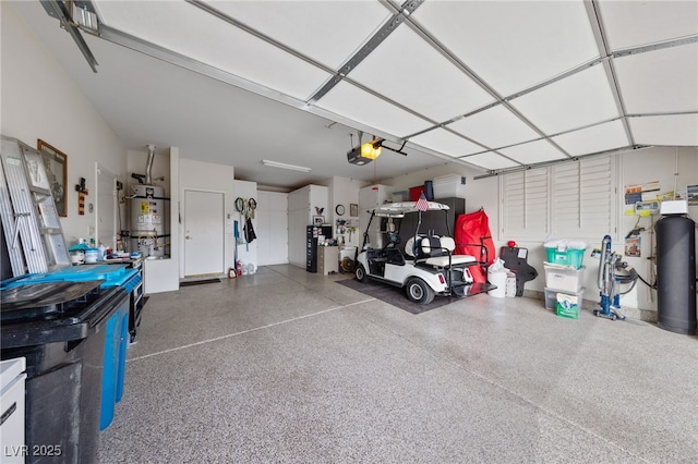 garage featuring secured water heater and a garage door opener