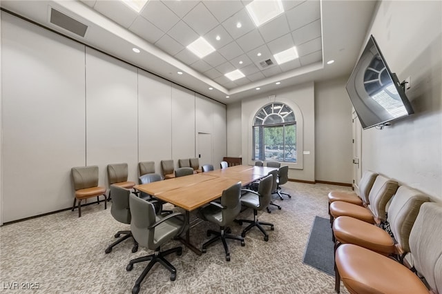 home office featuring light carpet, visible vents, and baseboards