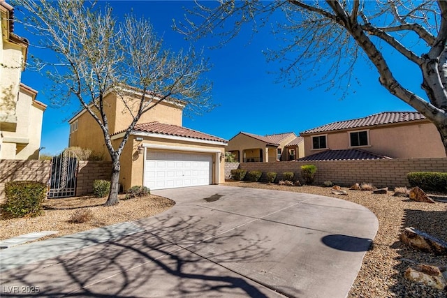 view of front of home with a garage, a tiled roof, fence, and stucco siding