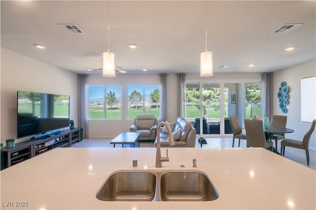 4400 E Cactus Canyon Dr, Pahrump, NV 89061 - kitchen featuring visible vents, open floor plan, a sink, and pendant lighting