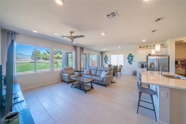 4400 E Cactus Canyon Dr, Pahrump, NV 89061 - living area with ceiling fan, light tile patterned flooring, recessed lighting, visible vents, and baseboards