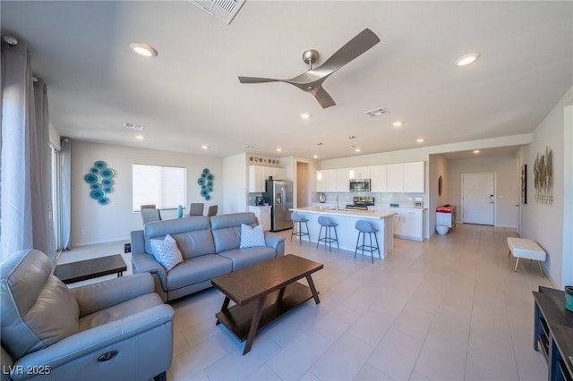 4400 E Cactus Canyon Dr, Pahrump, NV 89061 - living room with a ceiling fan, recessed lighting, and visible vents