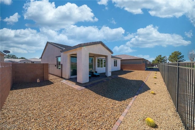 4400 E Cactus Canyon Dr, Pahrump, NV 89061 - back of house featuring a fenced backyard, a patio, and stucco siding