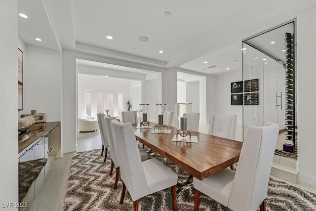 dining area with baseboards and recessed lighting