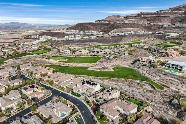 aerial view featuring a residential view, a mountain view, and golf course view