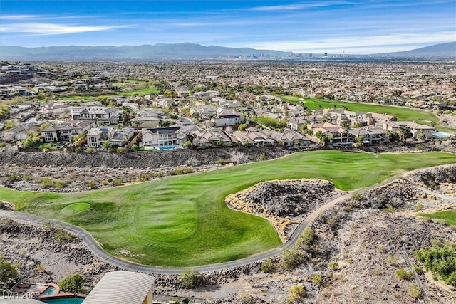 aerial view with a mountain view, view of golf course, and a residential view