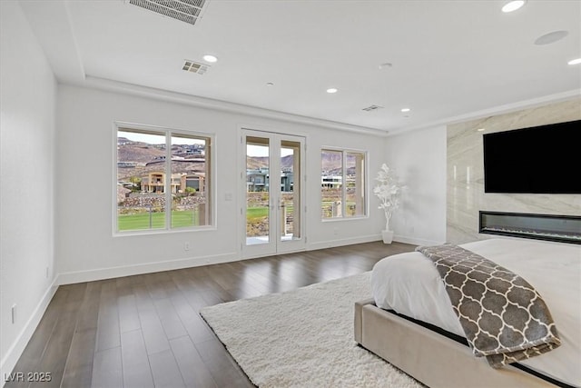 bedroom with access to outside, visible vents, and multiple windows