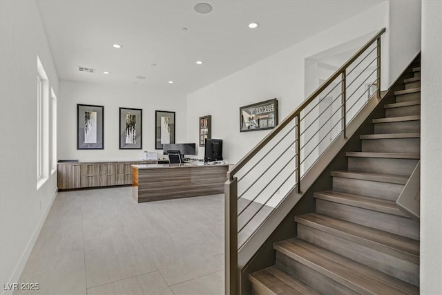 stairway featuring recessed lighting, tile patterned flooring, visible vents, and baseboards