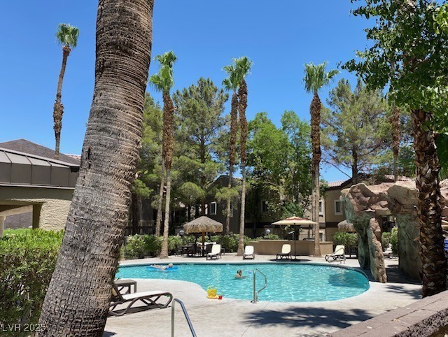 community pool with a patio area