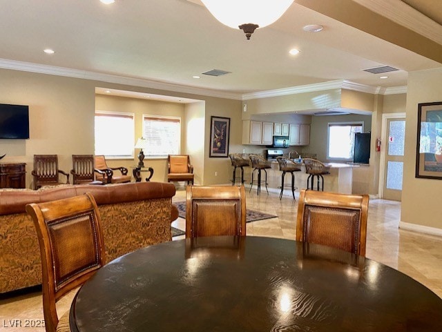 interior space with recessed lighting, visible vents, baseboards, and ornamental molding