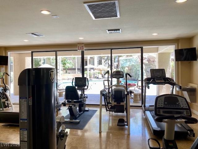 workout area featuring visible vents and recessed lighting