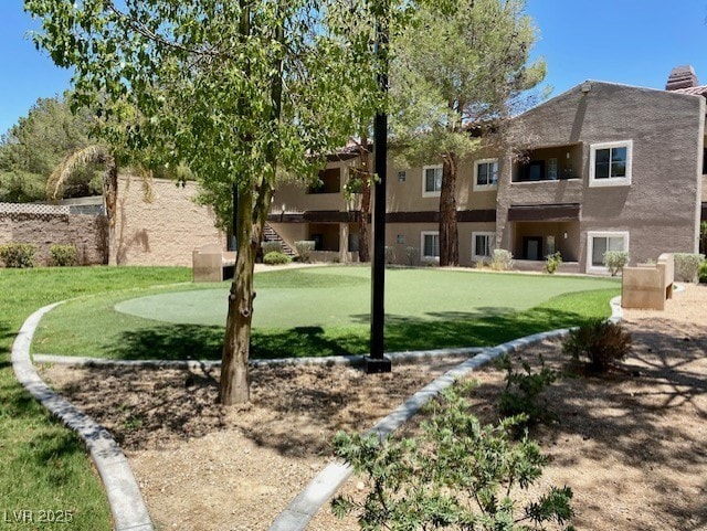 view of community featuring a lawn