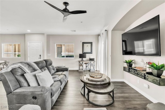 living room featuring recessed lighting, visible vents, a ceiling fan, baseboards, and dark wood finished floors