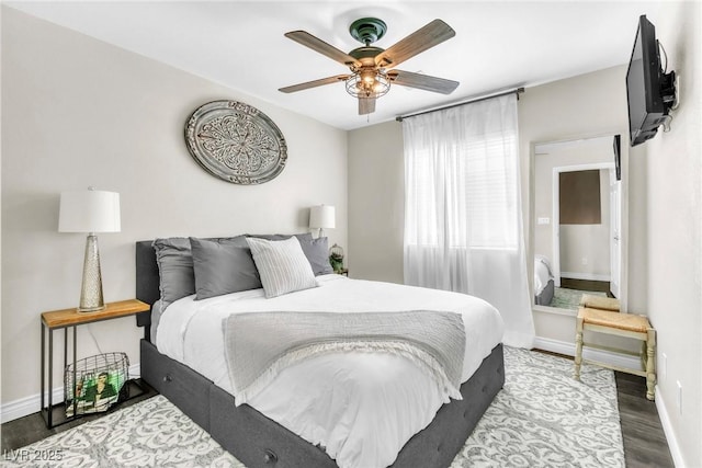 bedroom featuring ceiling fan, wood finished floors, and baseboards