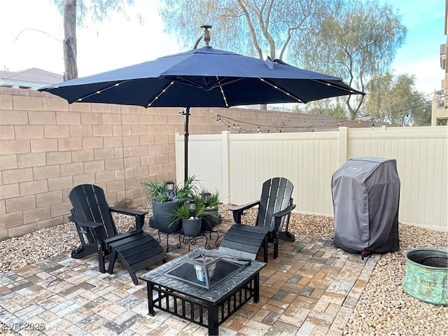 view of patio / terrace featuring a fenced backyard and grilling area