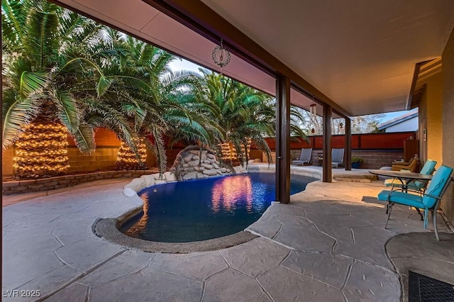 view of swimming pool with a fenced in pool, a patio, and a fenced backyard