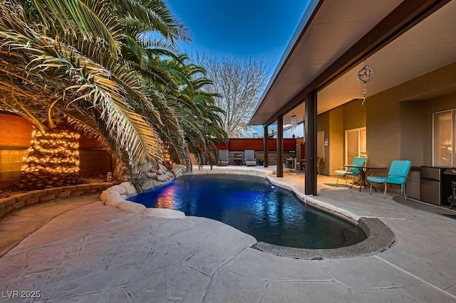 view of swimming pool with a patio, a fenced backyard, and a fenced in pool