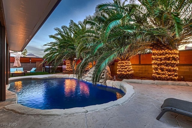 view of swimming pool featuring a fenced in pool and a patio