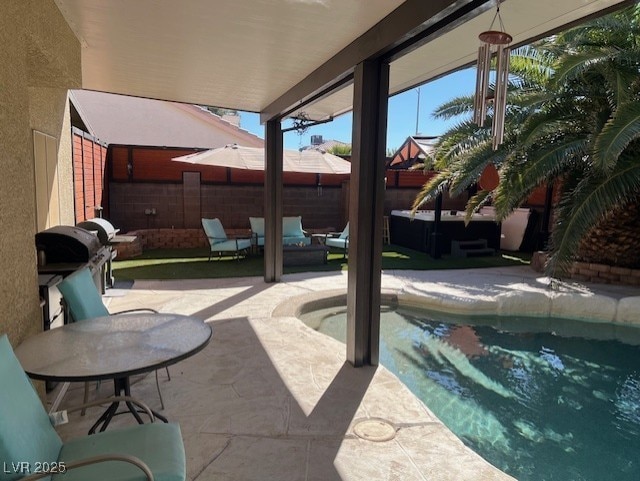 view of swimming pool featuring area for grilling, fence, a fenced in pool, an outdoor hangout area, and a patio area