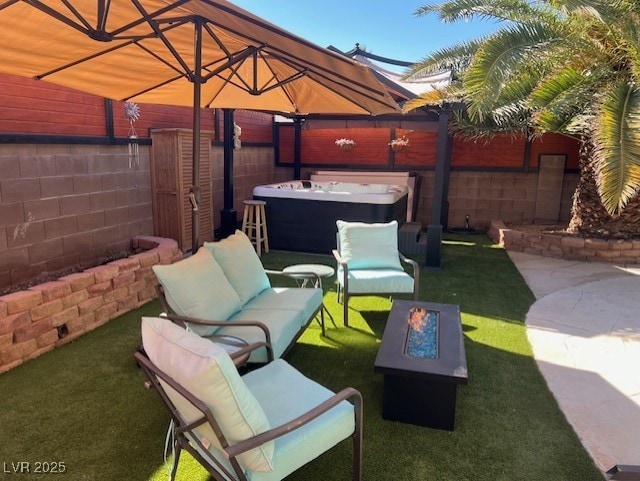 view of patio / terrace featuring an outdoor living space, a fenced backyard, and a hot tub