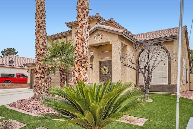 mediterranean / spanish-style home featuring a tile roof, a front yard, stucco siding, a garage, and driveway