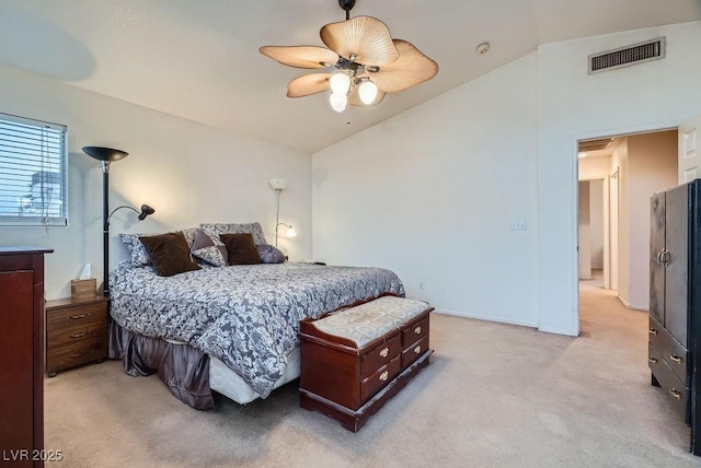 bedroom with visible vents, lofted ceiling, light colored carpet, and a ceiling fan