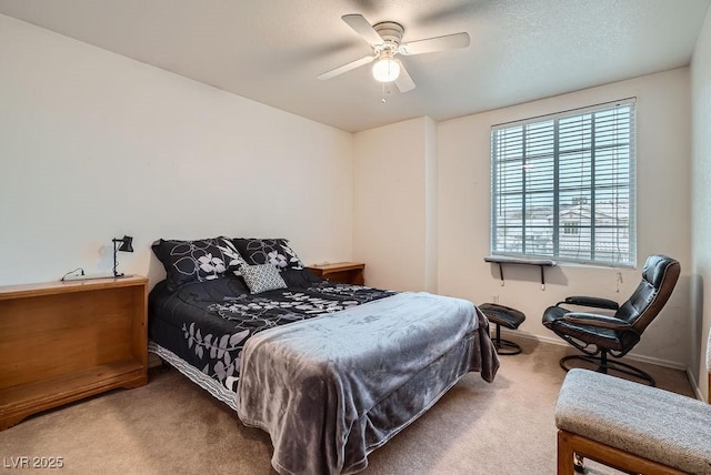 bedroom with a ceiling fan, carpet, and baseboards