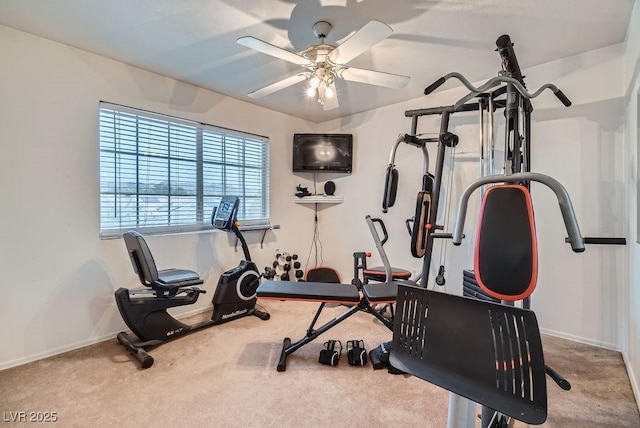 workout room featuring carpet flooring, a ceiling fan, and baseboards