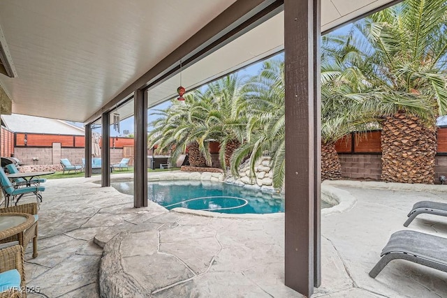 view of pool featuring a fenced backyard, a fenced in pool, and a patio