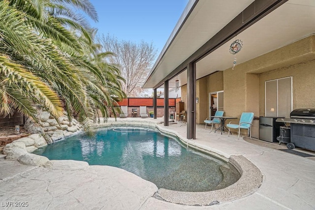 view of pool featuring a patio, area for grilling, a fenced backyard, and a fenced in pool